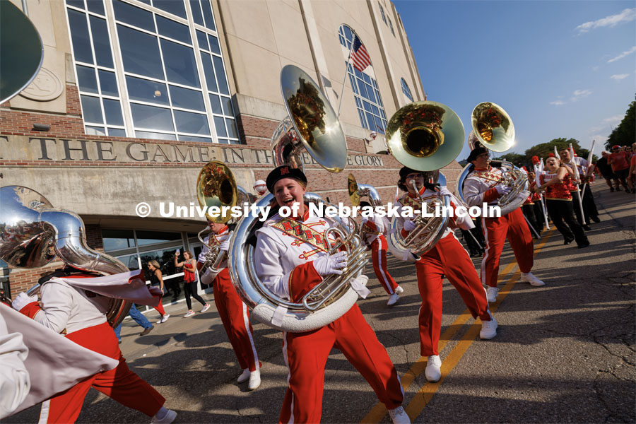 Sousaphone section of the Cornhusker Marching Band dances their way into the stadium. Northern Illinois football in Memorial Stadium. September 16, 2023. Photo by Craig Chandler / University Communication.