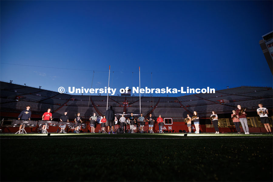 The drum line practices during their 6:30 am section practice before the full band practice. Cornhusker Marching Band early morning practice. September 19, 2023. Photo by Craig Chandler / University Communication.