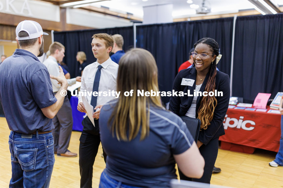 Maryam Sule talks with a recruiter at the Career Fair in the Nebraska Union. September 20, 2023. Photo by Craig Chandler / University Communication.