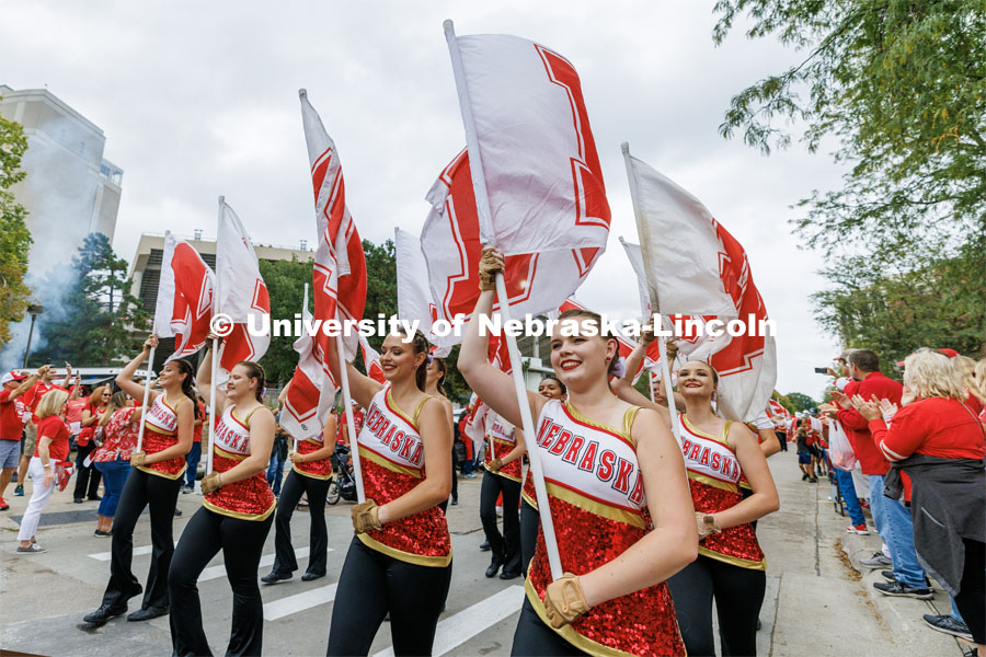 The Cornhusker Marching Band Color Guard marches to the stadium. Nebraska football vs. Louisiana Tech. August 23, 2023. Photo by Craig Chandler/ University Communication.