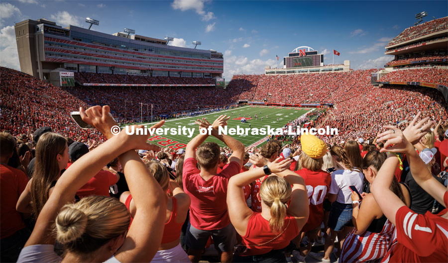 Fans in the student section throw the bones. Nebraska football vs. Louisiana Tech. August 23, 2023. Photo by Craig Chandler/ University Communication.