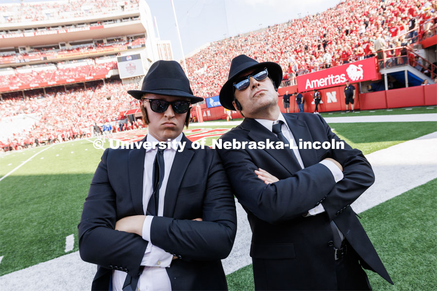 The halftime show honored the music of the Blues Brothers.  The Blues Brothers were played by current Husker band member Jacob Vanderford, left, and Jon Vanderford, his dad and former band member. Nebraska football vs. Louisiana Tech. August 23, 2023. Photo by Craig Chandler/ University Communication.