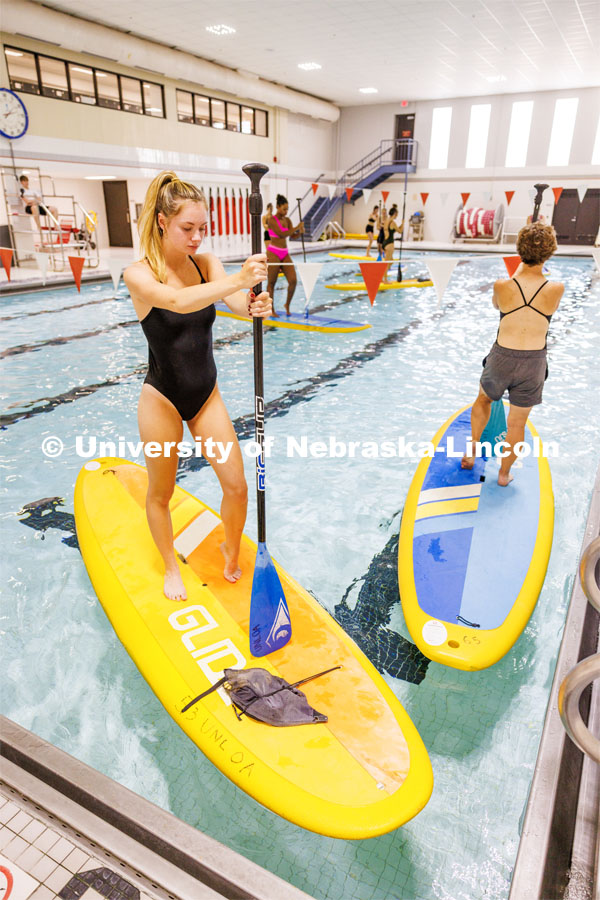 Paddleboard Yoga in the rec center pool as part of National Women's Health and Fitness Day. September 27, 2023. Photo by Craig Chandler / University Communication.