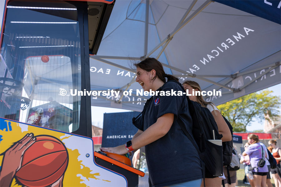 Frances Haugh plays with a basketball mini game at Hanging with the Huskers event. September 29, 2023. Photo by Dillon Galloway for University Communications.