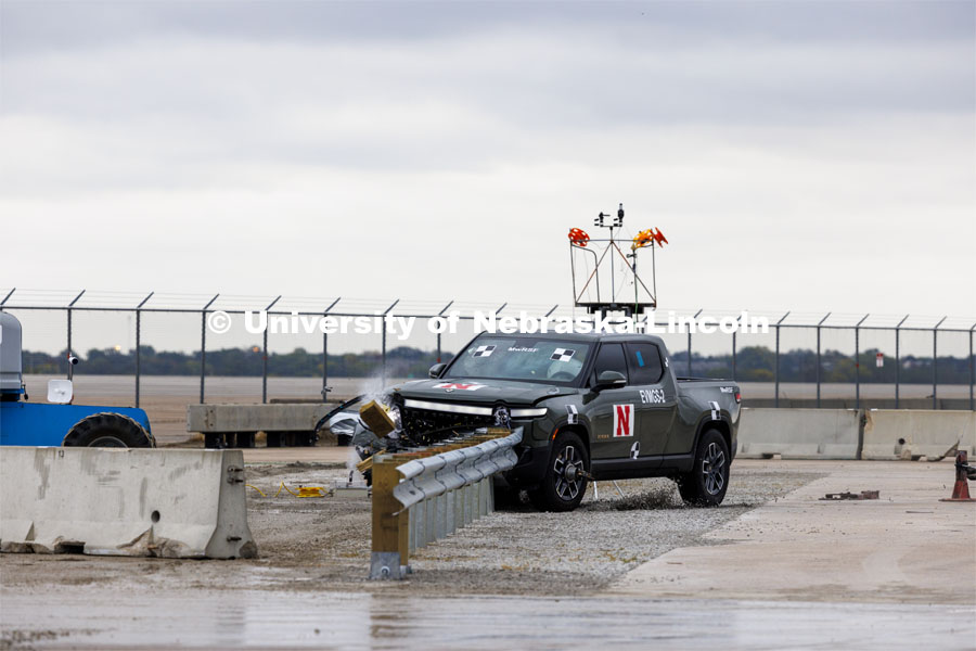 In research sponsored by the U.S. Army Engineer Research and Development Center, the University of Nebraska-Lincoln’s Midwest Roadside Safety Facility is investigating the safety and military defense questions raised by the burgeoning number of electric vehicles on the nation’s roadways. crash test performed on a guardrail on October 12, 2023, highlighted the concern. At 60 mph, the 7,000-plus-pound, 2022 Rivian R1T truck tore through a commonly used guardrail system with little reduction in speed. October 12, 2023. Photo by Craig Chandler / University Communication and Marketing.