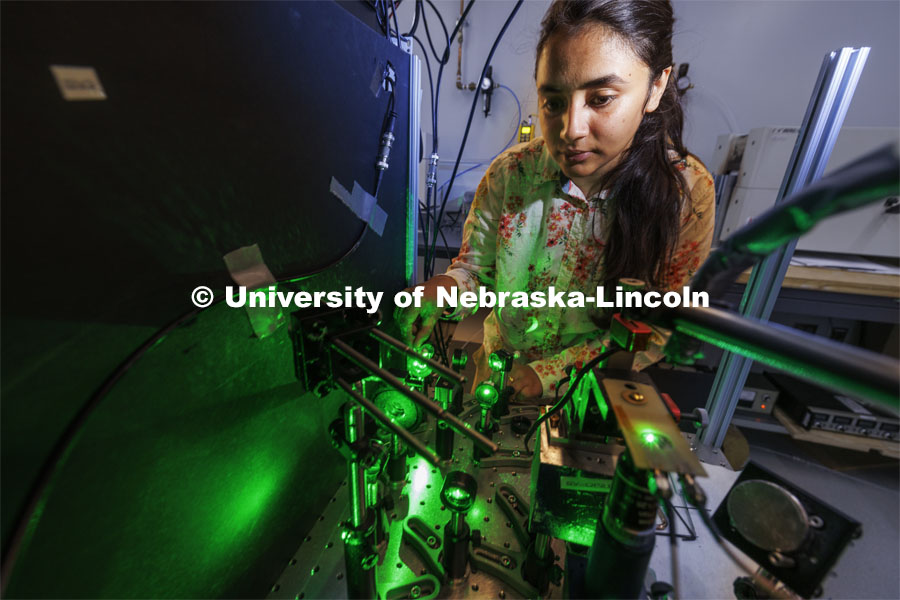 Suvechhya Lamichhane, graduate student in engineering, works with her laser experiment in the Laraoui lab. Abdelghani Laraoui, is working to find materials that would improve the performance of quantum computing. To do this, they need to create an environment that is super cold – talking close to zero Kelvin. Laraoui said the NSF money, in part, is helping to fund the purchase of a state-of-the-art MRI that creates such cold environments. It would make UNL one of the few places in the US that this type of research could take place. October 12, 2023. Photo by Craig Chandler / University Communication.
