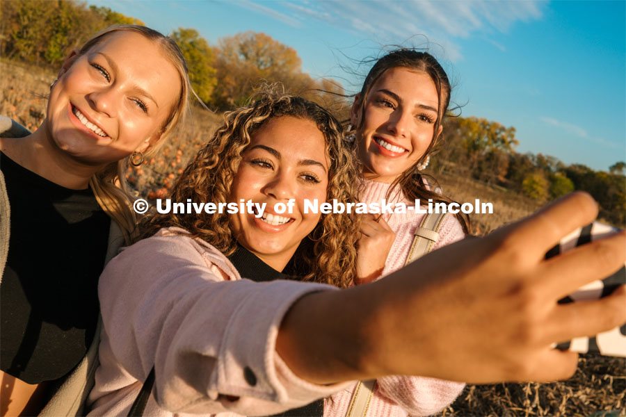 Husker Cheer Squad take a selfie at Roca Berry Farm. About Lincoln at Roca Berry Farm. October 22, 2023. Photo by Matthew Strasburger / University Communication.