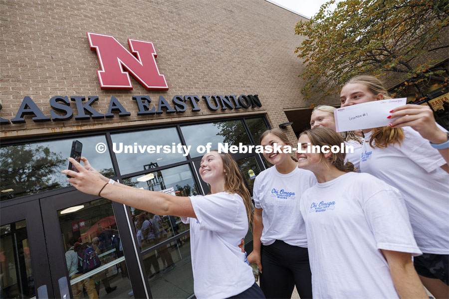 Team Chi Omega takes a selfie in front of the Nebraska East Union before beginning the race. Homecoming Traditions Race. Registered teams compete in a race to find 10 landmarks in an hour on UNL’s East Campus. October 24, 2023. Photo by Craig Chandler / University Communication.