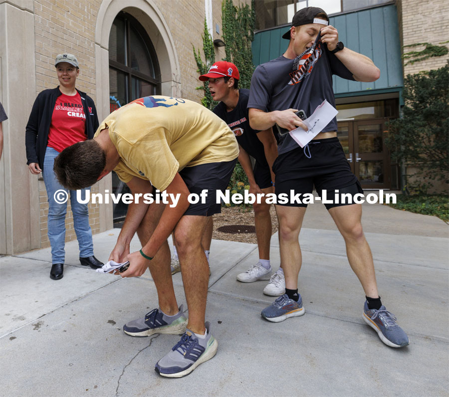 The Newman Center team catches their breath after completing the race outside the Dairy Store. Homecoming Traditions Race. Registered teams compete in a race to find 10 landmarks in an hour on UNL’s East Campus. October 24, 2023. Photo by Craig Chandler / University Communication.