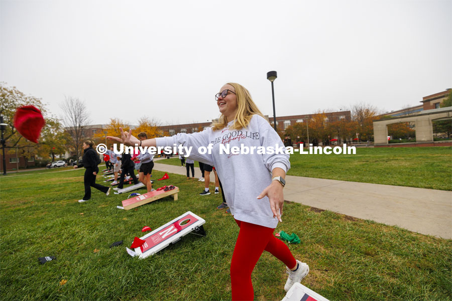 Bags fly at Cornhole Tournament for Homecoming in the greenspace by the Nebraska Union. October 25, 2023. Photo by Craig Chandler / University Communication.