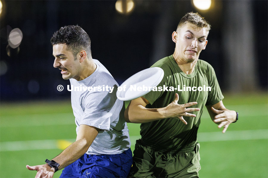 Air Force, left, and Navy have a mid-air collision during their Ultimate Frisbee competition. ROTC Joint Field Meet is like an ROTC Olympics for the Nebraska cadets and midshipman. Army, Air Force and Navy/Marine cadets and midshipman compete in events such as Maneuvering Under Fire, Log Sit-ups, Tug-Of-War, Casualty Evacuation and Ultimate Frisbee. Army beat Navy in a sudden death 4x400 relay to claim the title. October 26, 2023. Photo by Craig Chandler / University Communication.