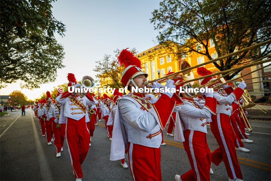 The Cornhusker Marching Band marches down R Street to begin the parade. Homecoming parade and Cornstock. October 27, 2023. Photo by Craig Chandler / University Communication.