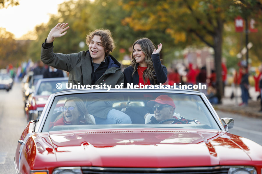 Homecoming royalty candidates Cordell Vrbka and Rachel Morros wave to the crowd along the parade route. Homecoming parade and Cornstock. October 27, 2023. Photo by Craig Chandler / University Communication.