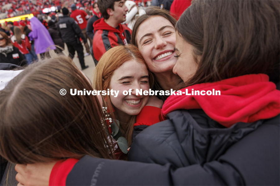 Hannah-Kate Kinney of Omaha is hugged by several of her Chi Omega sisters after she was crowned homecoming royalty at the University of Nebraska–Lincoln. Seniors Preston Kotik of Hooper and Hannah-Kate Kinney of Omaha were crowned homecoming royalty at halftime of the University of Nebraska–Lincoln versus Purdue game. Nebraska football versus Purdue Homecoming game. October 28, 2023. Photo by Craig Chandler / University Communication.