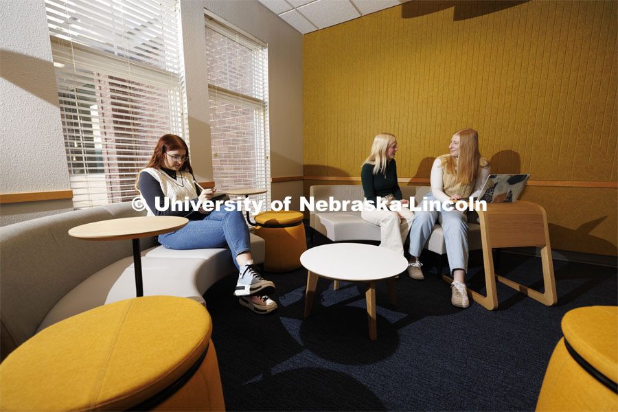 Sarah Danahy, left, Madalyn Schoneman and Alexis Tenorio study in the Knoll Residential Center lounge. A University of Nebraska–Lincoln team’s proposed renovation of a little-used TV lounge in the Robert E. Knoll Residential Center features multiple study spaces designed to allow for collaboration between students won the 2019 Big Ten Academic Alliance Student Design Challenge. Following pandemic delays, the furniture has been delivered. The annual contest, supported by the Herman Miller furniture company, allows students to develop and pitch a renovation of an existing campus space. November 17, 2023. Photo by Craig Chandler / University Communication and Marketing.