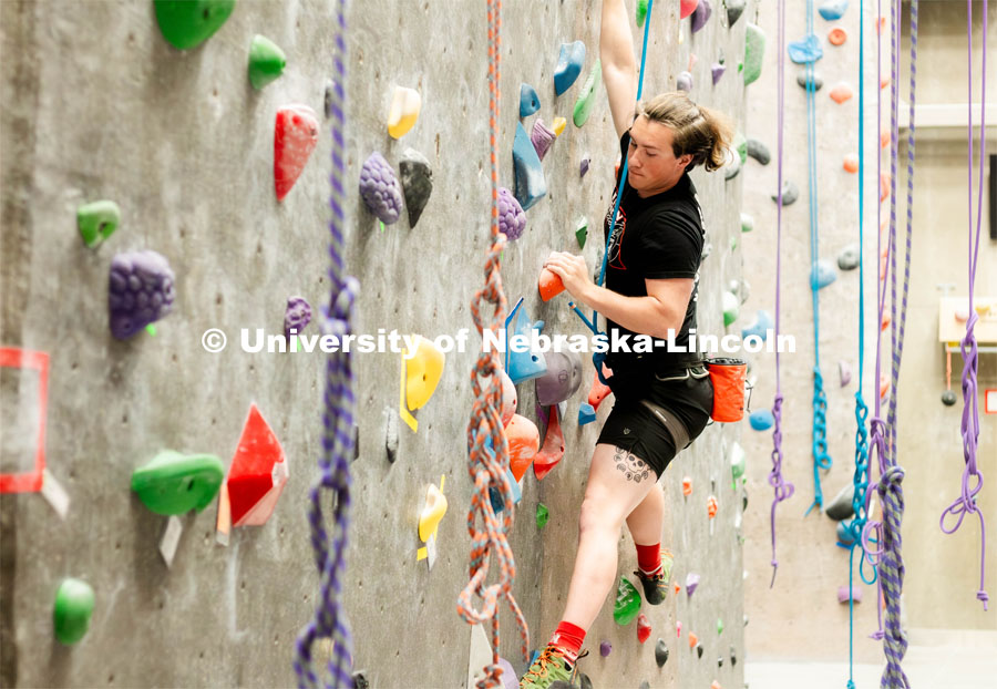 At the Outdoor Adventure Center, open until 10pm, you can find the rock-climbing wall where students like Easton Wieczorek opt for a later and quieter rock-climbing session. Outdoor recreation center at night. November 27, 2023. Photo by Kylie Galvin / Office of Student Affairs.