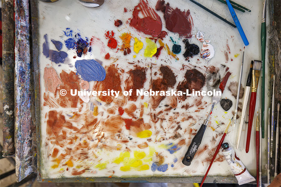 A paint pallet of mixed paints. Students work on their master study painting in Aaron Holz’ PANT 251: Beginning Painting course in Richards Hall. November 29, 2023. Photo by Craig Chandler / University Communication and Marketing.