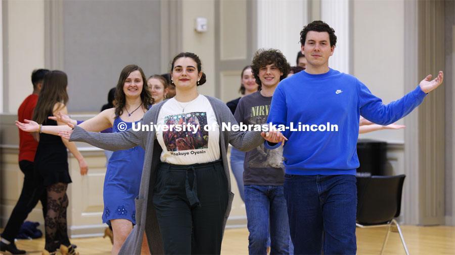 A group parades onto the floor. Ballroom Dancing Club works through their final practice in the Nebraska Union Ballroom Thursday night before Saturday’s show. December 7, 2023. Photo by Craig Chandler / University Communication and Marketing.