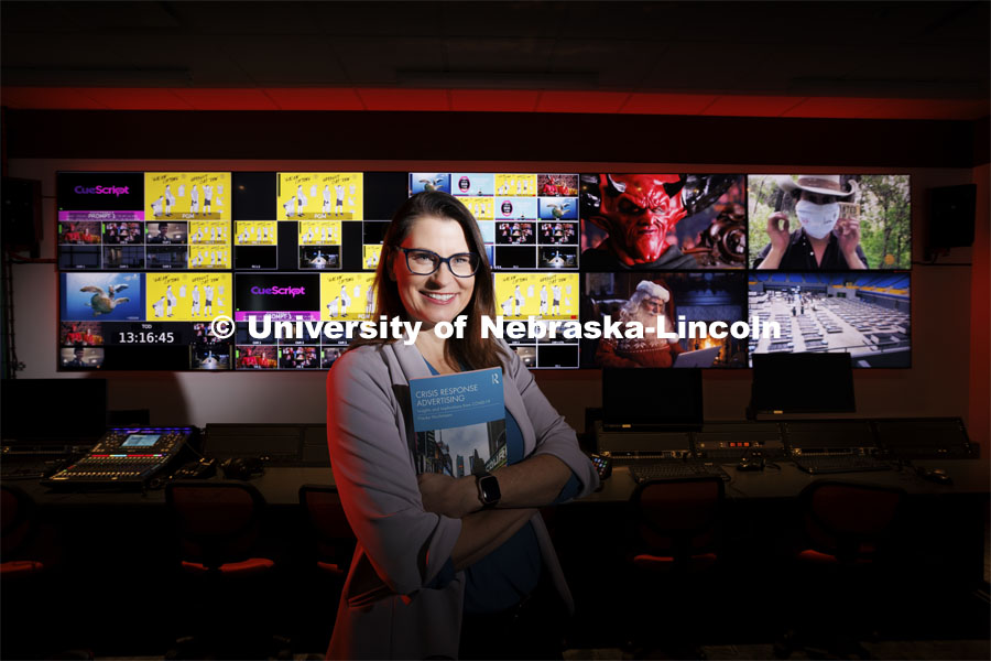Frauke Hachtmann, Professor in Advertising, has published her research on Complex Crisis Response Advertising using examples of COVID-19 advertising as seen on the video screens in the CoJMC production studio. December 7, 2023. Photo by Craig Chandler / University Communication and Marketing.