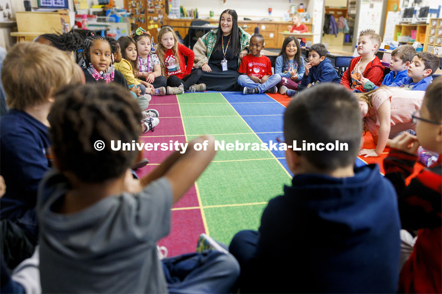 Crandall Blake student teaches her kindergarten class at Lakeview Elementary. She had her students sign a pair of white high-top shoes which she will wear at commencement so “her entire class can walk across stage with her”. December 13, 2023. Photo by Craig Chandler / University Communication and Marketing.