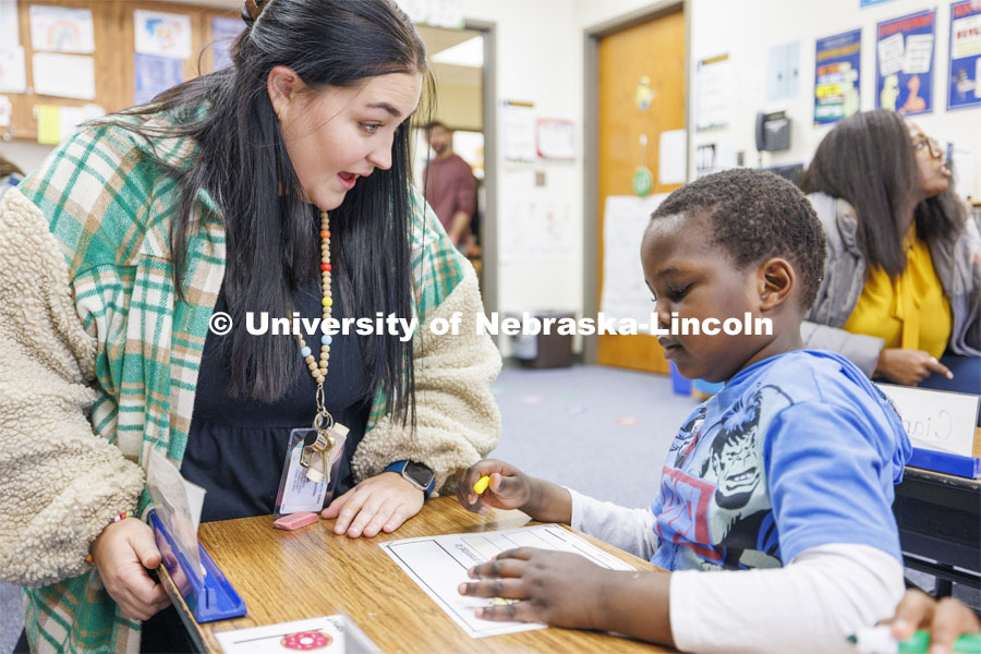 Crandall Blake student teaches her kindergarten class at Lakeview Elementary. She had her students sign a pair of white high-top shoes which she will wear at commencement so “her entire class can walk across stage with her”. December 13, 2023. Photo by Craig Chandler / University Communication and Marketing.