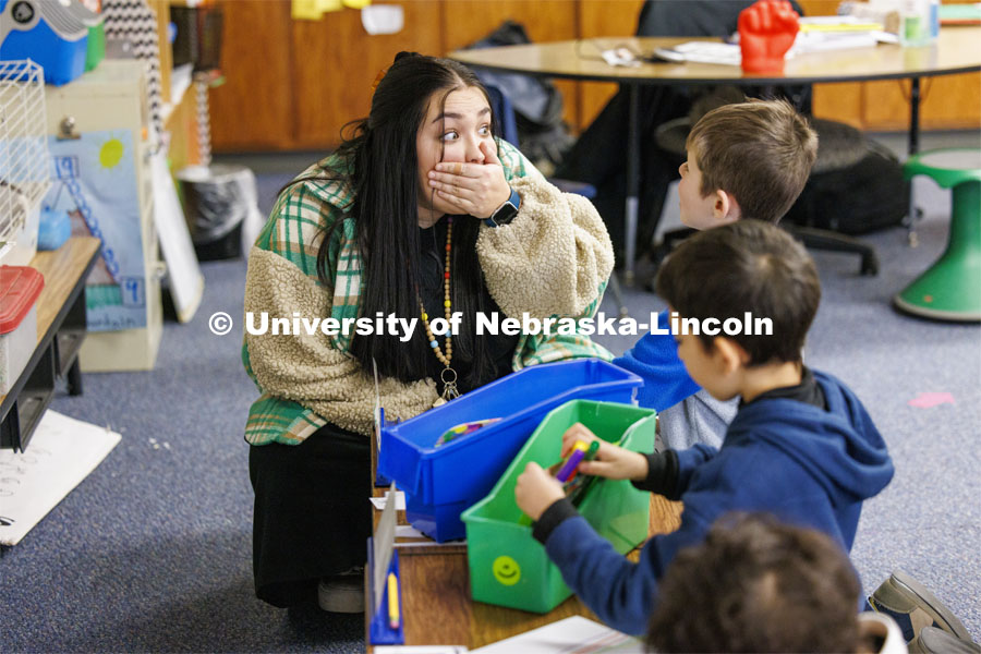 Crandall Blake student teaches her kindergarten class at Lakeview Elementary. She had her students sign a pair of white high-top shoes which she will wear at commencement so “her entire class can walk across stage with her”. December 13, 2023. Photo by Craig Chandler / University Communication and Marketing.