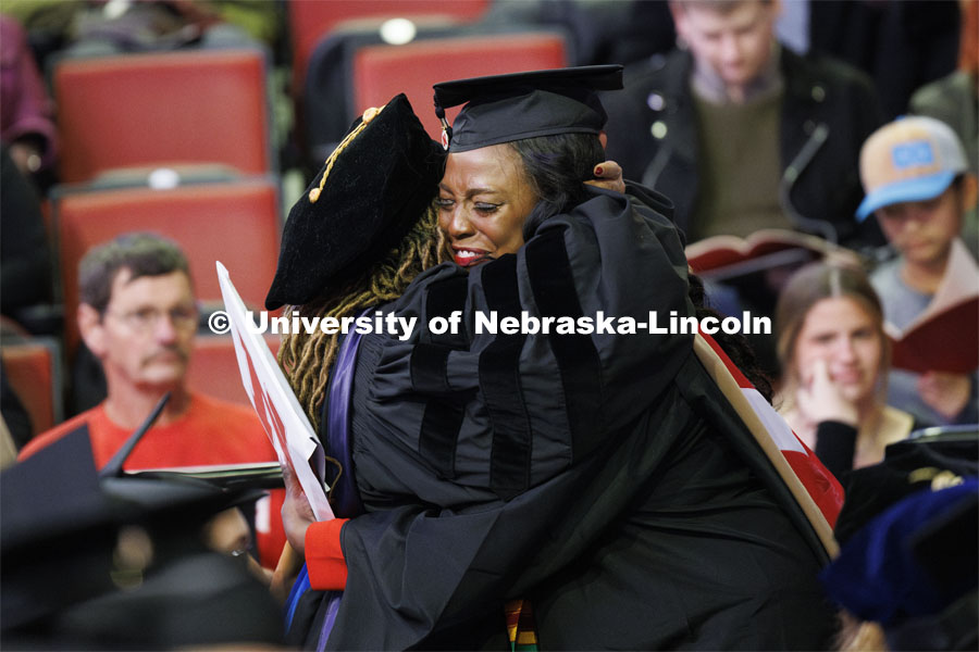 Marlenia Jewell Thornton hugs Jeanette Jones after Thornton received her MBA diploma. Graduate Commencement at Pinnacle Bank Arena. December 15, 2023. Photo by Craig Chandler / University Communication and Marketing.