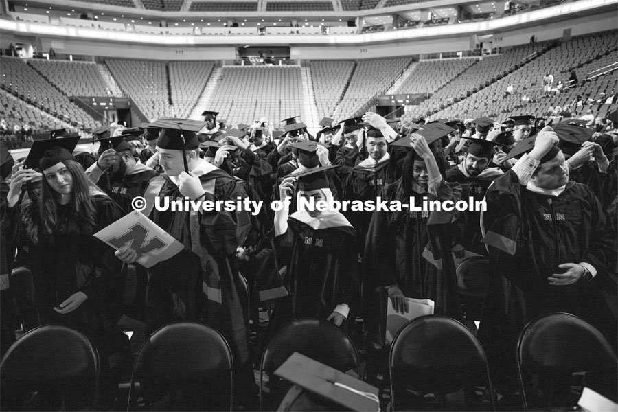 New graduates turn their tassels. Graduate Commencement at Pinnacle Bank Arena. December 15, 2023. Photo by Craig Chandler / University Communication and Marketing.