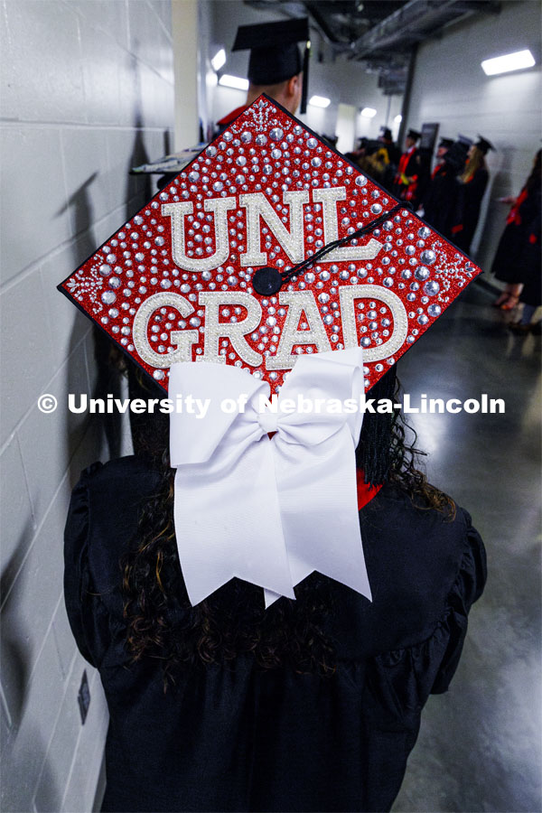 Monica Houston, CEHS grad, with her mortar board. Winter undergraduate commencement in Pinnacle Bank Arena. December 16, 2023. Photo by Craig Chandler / University Communication and Marketing.