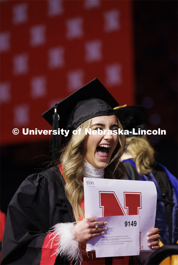 Catherine Wisniewski celebrates her psychology degree. Winter undergraduate commencement in Pinnacle Bank Arena. December 16, 2023. Photo by Craig Chandler / University Communication and Marketing.