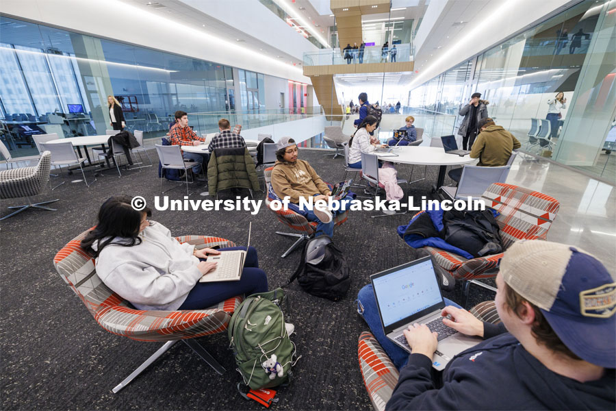 Students sit in study areas Monday morning awaiting their first classes. First day of classes in Kiewit Hall. January 22, 2024. Photo by Craig Chandler / University Communication and Marketing.