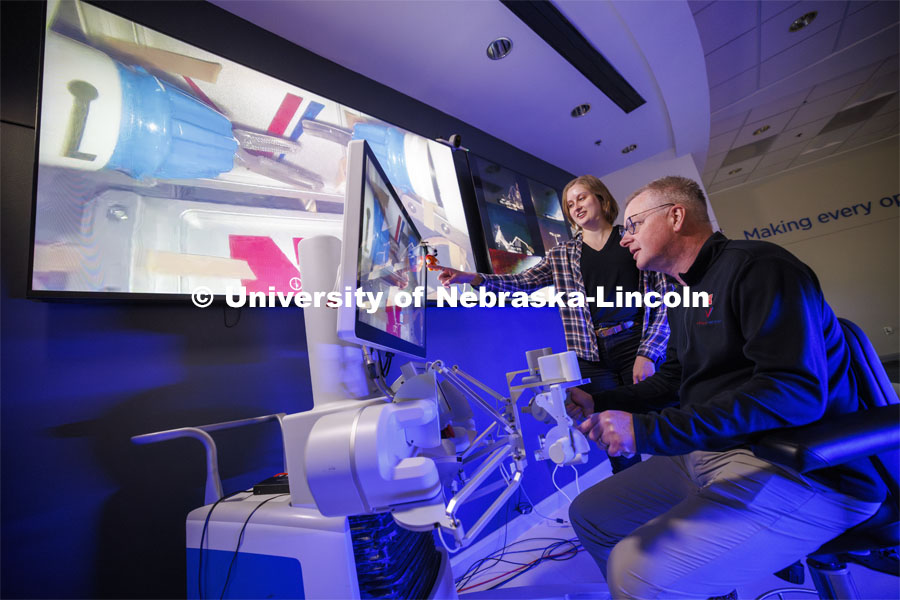 Nebraska Engineering professor and Virtual Incision founder Shane Farritor successfully performed robotic surgery on the International Space Station as Rachael Wagner, a Husker doctoral student, looks on. Controlled from the Virtual Incision offices in Lincoln, NE, surgeons cut rubber bands–mimicking surgery–inside a payload box on the International Space Station. February 10, 2024. Photo by Craig Chandler / University Communication and Marketing.