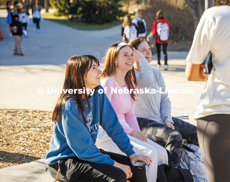 Group of friends sit and chat outside of the Union on City Campus. February 20, 2024. Photo by Kristen Labadie / University Communication.