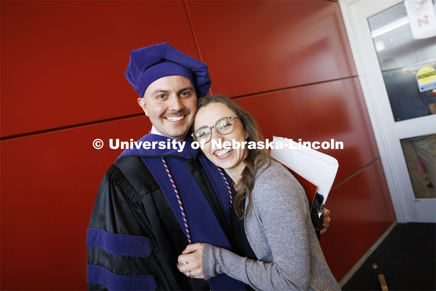 Grant Jones and his wife, Mikayla, following the ceremony. Mikayla will be a third-year Nebraska Law student in the fall. College of Law commencement in Devaney on the volleyball court. May 3, 2024. Photo by Craig Chandler / University Communication and Marketing.