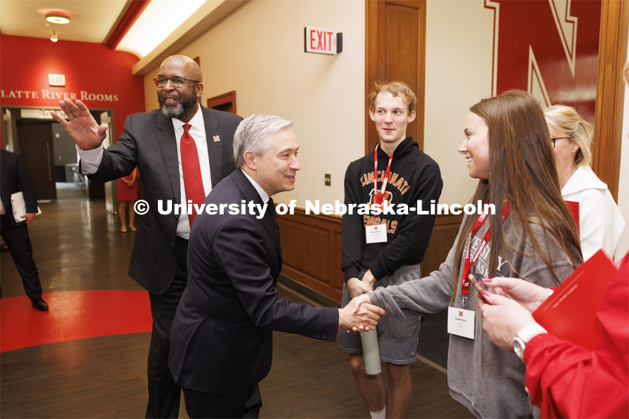 Canadian Minister Francois-Philippe Champagne introduced himself to touring high school students Camryn Fisher of Elkhorn, right, and Maxwell Pritchett Peterson of Lincoln as Chancellor Rodney Bennett greeted the Canadian. Champage is on campus today to have a fireside chat with Jill O’Donnell of the Yeutter Institute. May 3, 2024. Photo by Craig Chandler / University Communication and Marketing.