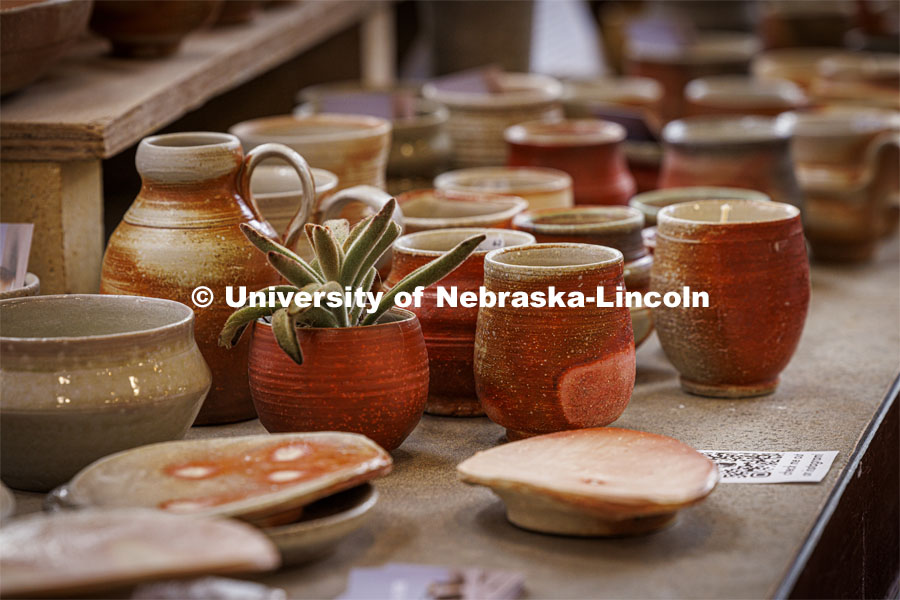 Pottery sits on a table awaiting a buyer at the end of year exhibitions and art sales in the College of Fine Arts. May 10, 2024. Photo by Craig Chandler / University Communication and Marketing.