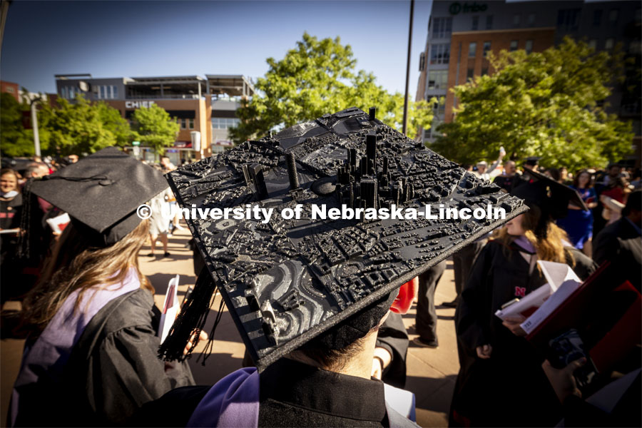 Jacob Granger, a masters student in architecture, 3-D printed a city scape for his mortarboard. Graduate Commencement. May 17, 2024. Photo by Craig Chandler / University Communication and Marketing.