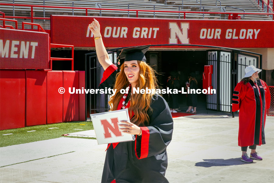 Avery Clason, a Secondary Education major, celebrates receives her diploma. Undergraduate Commencement in Memorial Stadium. May 18, 2024. Photo by Kristen Labadie / University Communication.