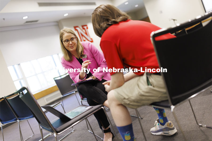 Jenni Brost, Director of New Student Enrollment, and orientation leader Dalton Cooper review a video being planned for NSE. May 23, 2024. Photo by Craig Chandler / University Communication and Marketing.