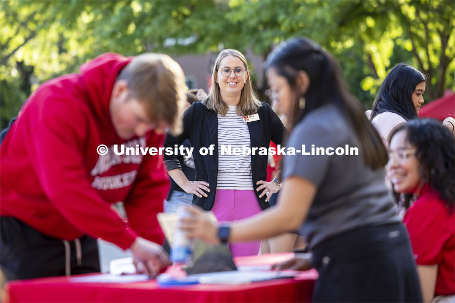 Jenni Brost, Director of New Student Enrollment watches orientation leaders outside the Union. May 23, 2024. Photo by Craig Chandler / University Communication and Marketing.