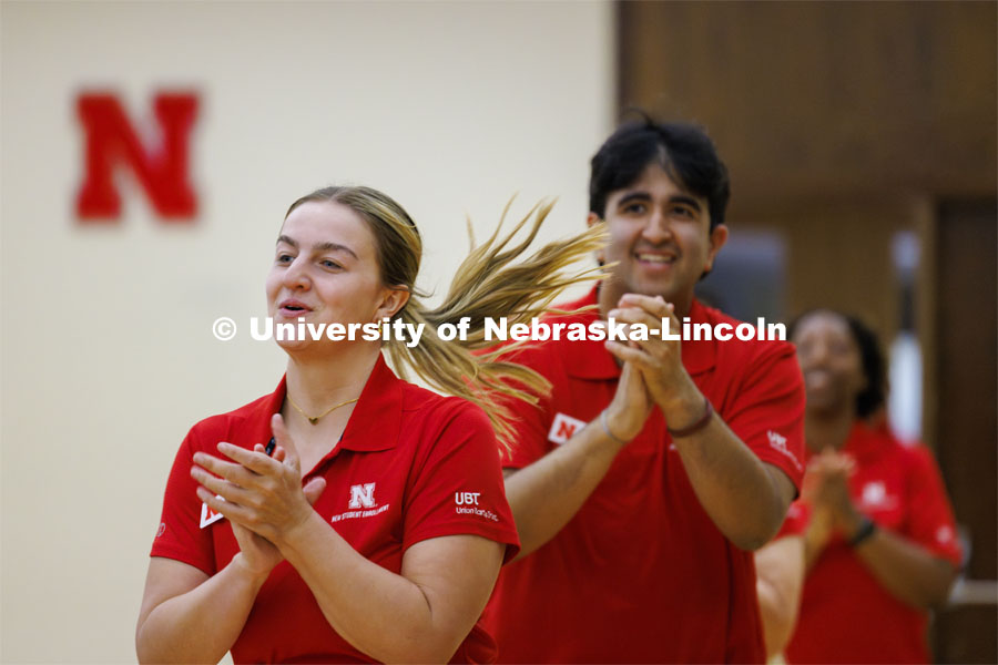 Madison Sheets runs towards the stage in the Centennial Ballroom as the NSE Orientation Leaders do their welcome and closing sessions to the summer academic advisors attending a luncheon. New Student Enrollment. May 23, 2024. Photo by Craig Chandler / University Communication and Marketing.