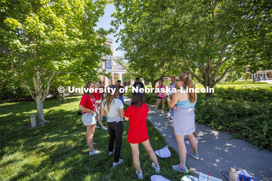 Makayla Larntz has her group in the shade as they play an ice-breaker game. NSE New Student Enrollment. June 5, 2024. Photo by Craig Chandler / University Communication and Marketing.