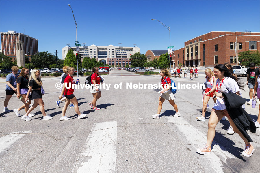 NSE groups cross at 14th and Vine streets as the groups go to their rotations. NSE New Student Enrollment. June 5, 2024. Photo by Craig Chandler / University Communication and Marketing.