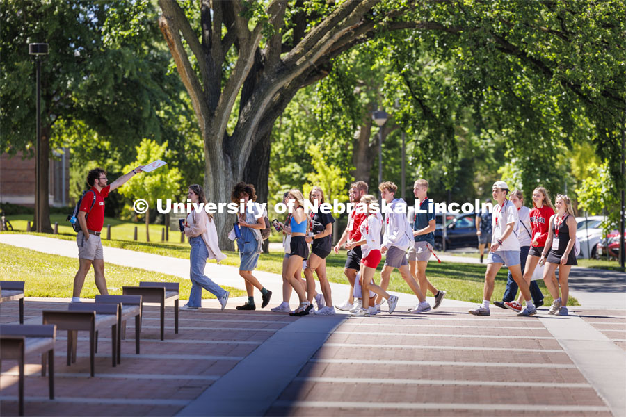 Jameson Margetts leads his group across campus to their next rotation. NSE New Student Enrollment. June 5, 2024. Photo by Craig Chandler / University Communication and Marketing.