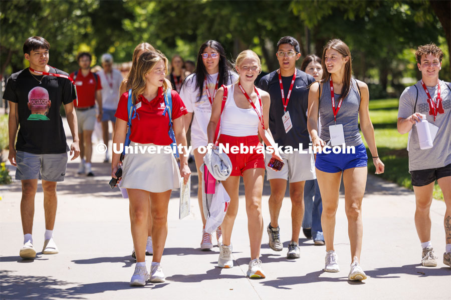 Claire Kelly leads her group across campus to their next rotation. NSE New Student Enrollment. June 5, 2024. Photo by Craig Chandler / University Communication and Marketing.