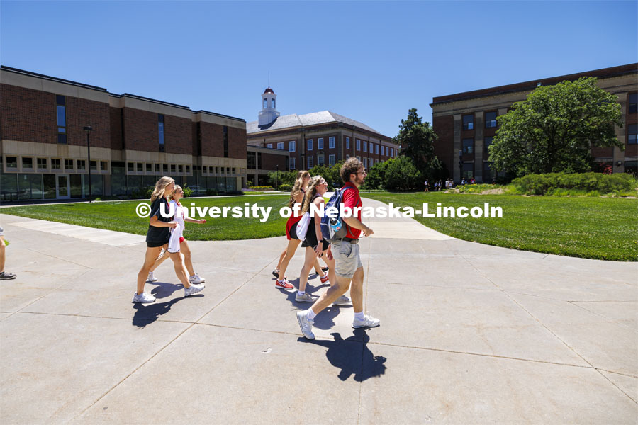 Jameson Margetts leads his group across campus to their next rotation. NSE New Student Enrollment. June 5, 2024. Photo by Craig Chandler / University Communication and Marketing.