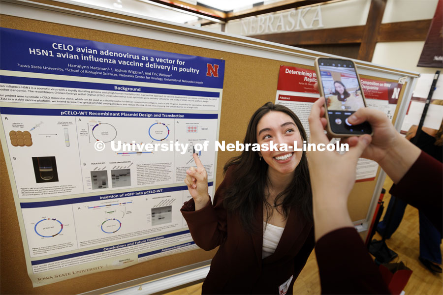 Hamelynn Harzman of Iowa State University poses for a photo by her poster board neighbor Adrian Dunivan of the University of Missouri. Undergraduate students from the University of Nebraska–Lincoln and other institutions across the country present their summer research and creative activities in a poster session Aug. 6, 1-3 p.m. in Nebraska Union. The symposium showcases research and creative accomplishments by more than 160 undergraduate research students from a variety of research programs housed at UNL. August 6, 2024. Photo by Craig Chandler / University Communication and Marketing.