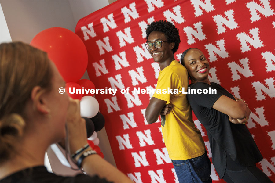 Isaiah Vasser and his mom, Shardea Gallion, are photographed by Smith Resident Hall RA Carrie Wehrman during move-in. The two are from St. Louis and Shardea is a 2008 UNL graduate in broadcasting. Harper Schramm Smith move-in. August 18, 2024. Photo by Craig Chandler / University Communication and Marketing.