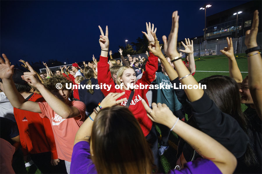 Everyone tries to organize and group themselves by their birth month. More than a thousand students gathered on the Vine Street Fields for Playfair: The Ultimate Icebreaker where students met others they didn’t know through dozens of quick activities. August 21, 2024. Photo by Craig Chandler / University Communication and Marketing.