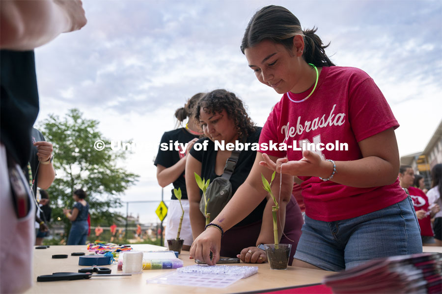 Students craft bracelets during the Suites-Courtyards Block Party event. Big Red Welcome events. August 22, 2024. Photo by Jordan Opp for University Communication.